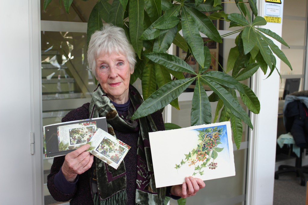 Local artist Catherine James with the Winter Flora miniature sheet due for release on January 6, 2014.
